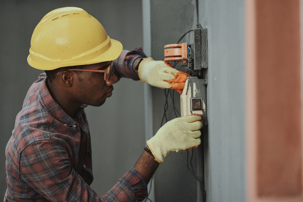 An electrician working on wiring